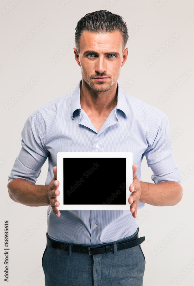 Wall mural businessman showing blank tablet computer screen