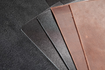 Two pieces of black leather