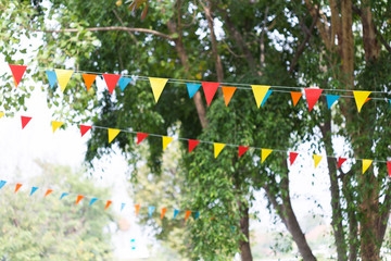colorful triangular flags of decorated celebrate outdoor party