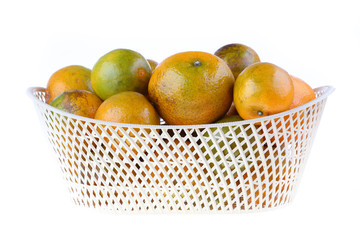 orange fruit in basket, isolated on white background