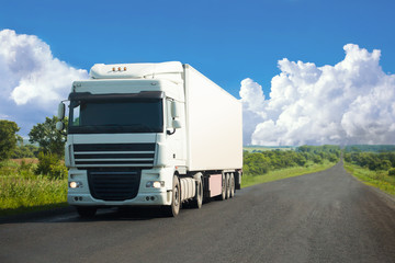 White truck moving on a road
