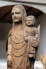 Fototapeta na wymiar Ancient medieval wooden statue of the Madonna with child