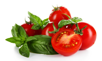 Cherry tomatoes with basil isolated on white