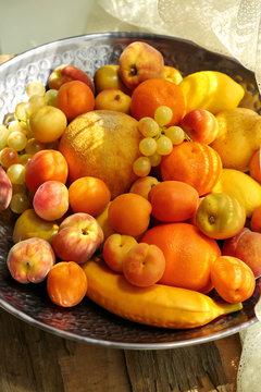 Heap of fresh fruits on tray close up