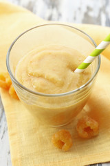 Raspberry smoothie with berries on table close up