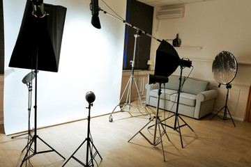 Empty photo studio with lighting equipment