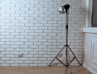 Empty photo studio with lighting equipment