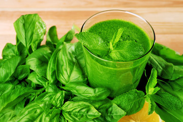 Green healthy juice with herbs close up