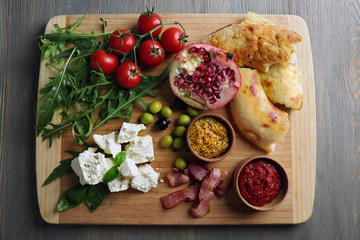 Ingredients of Mediterranean cuisine, on wooden board, top view