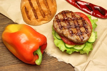 Close-up Top View Of Grilled Hamburger On Brown Paper