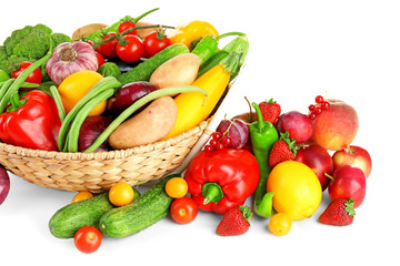 Heap of fresh fruits and vegetables  in basket close up