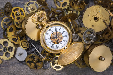 Fototapeta na wymiar Pocket Watch and old Clock Parts - Cogs, gears, wheels