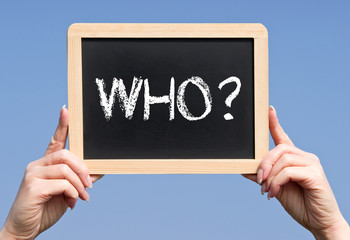 Who ? - female hands holding chalkboard