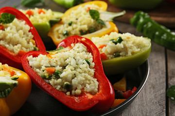 Stuffed peppers with vegetables on table close up