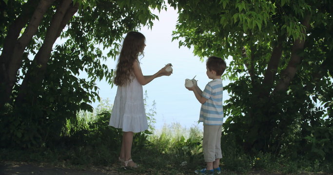Cute kids holding white doves and setting them free for a count of three