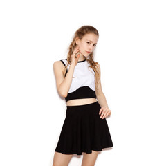 Fashion girl hipster with pigtails in a black skirt