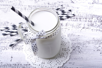a jar of milk on wooden table