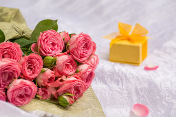 Wedding bouquet of beautiful pink roses with gift box for jewelry