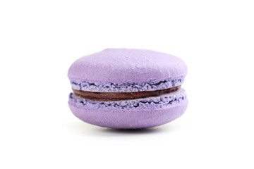 Tasty purple macaron isolated on white
