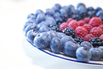 some sort of berries: blueberries, blackberries, raspberries