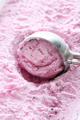 Sweet ice cream scooped out from container