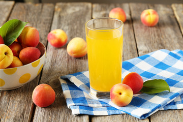 Apricot juice on a grey wooden background
