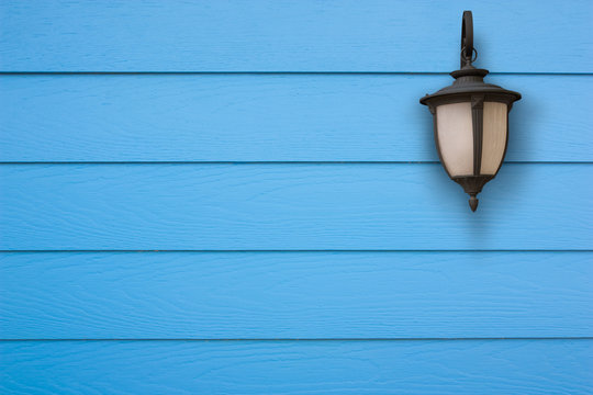Old lamp and shera plank wall blue, Vintage style.