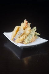 japanese cuisine. tempura seafood on the background