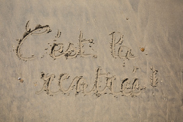 Back to school written in sand
