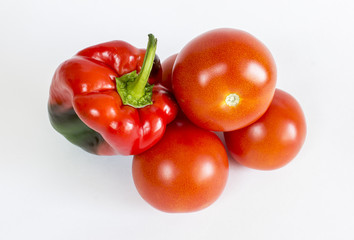 Fresh sweet pepper, tomatoes.  On a white background.