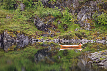 Reflection of a boat on a lake
