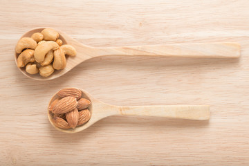 Spoon with cashew nuts and almonds