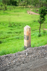 Black and white pole in wayside