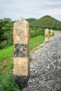 Black and white pole in wayside