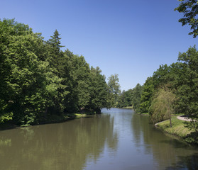 The lake in a summer garden in the morning.