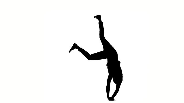 Modern style dancer dancing brake-dance, on white, slow motion