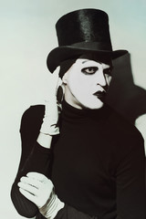 scary angry mime wearing a tall hat