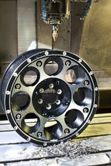 Car alloy black new rim in milling and lathe machine.