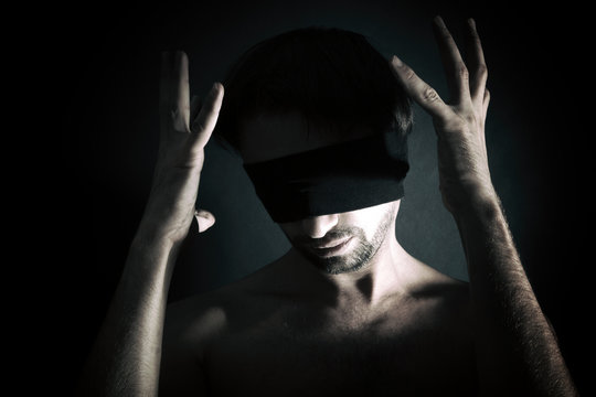 Premium AI Image  Blindfolded man in dramatic lights