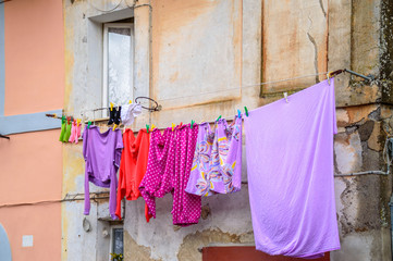 Drying colorful laundry on a wire outside the window