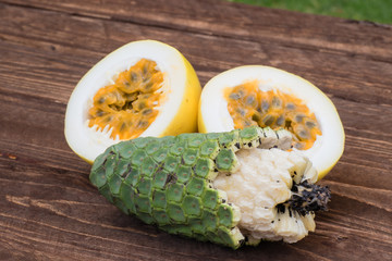 Exotic tropical fruit maracuja and ananas - banana (fruit of monstera deliciosa)