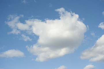 Naklejka na ściany i meble Clouds against the blue sky..