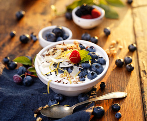 Natural yogurt with addition organic blueberries, bananas and muesli. 