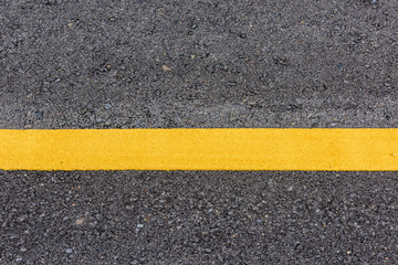 Fototapeta premium yellow line on the road texture