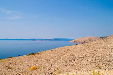 Rocky deserted landscape and the Adriatic sea on the island of K