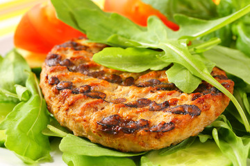 Grilled patty with rocket and cucumber salad