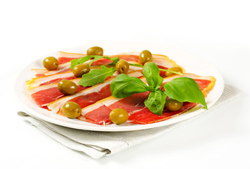 Prosciutto crudo with green olives