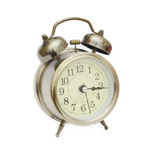 Old alarm clock isolated on white