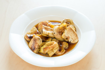 Thai snack grilled banana serve with syrup.