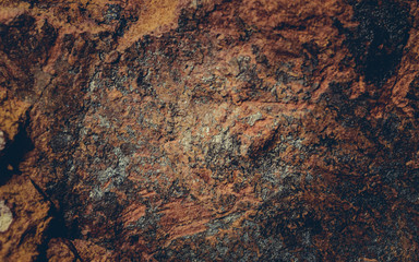Close up texture of grunge cracked old stone wall.